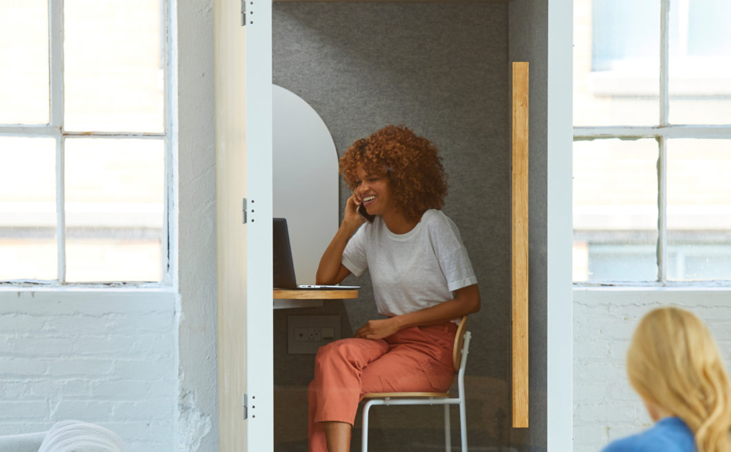 Woman on the phone and computer slouching