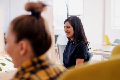 Woman slouched smiling in a study group