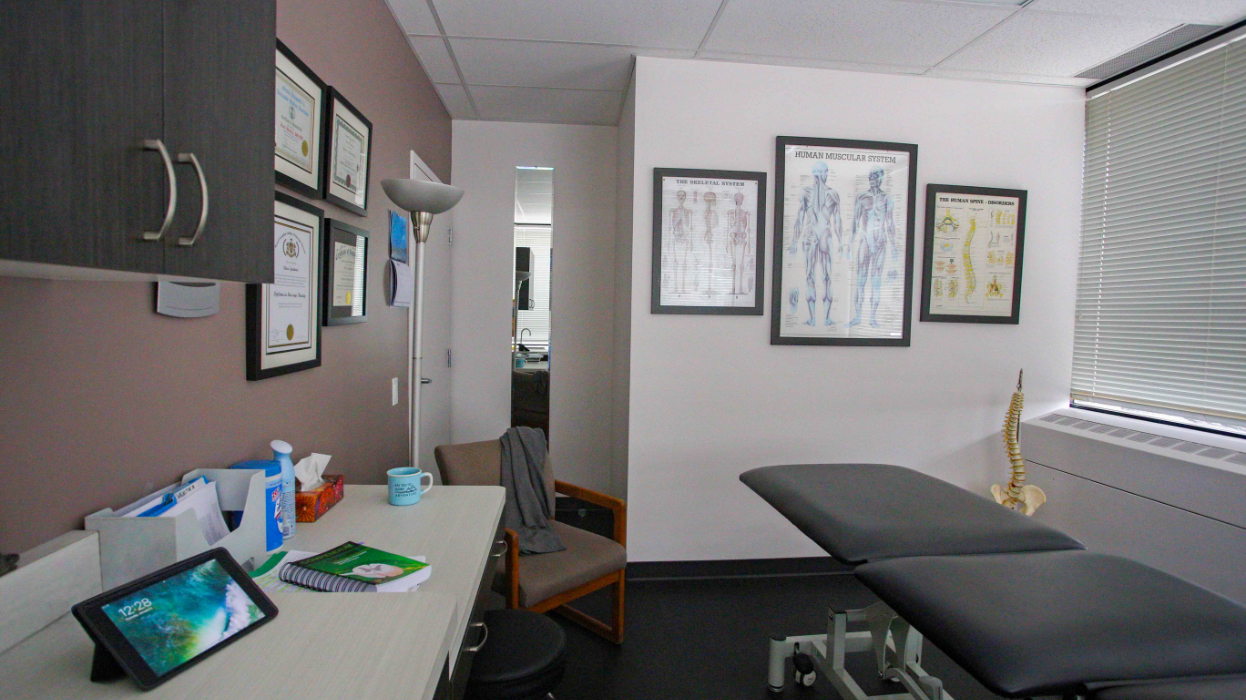 Osteopathic room with degrees and artwork on the walls